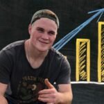 Zach Bryan’s net worth: Zach Bryan showing thumbs up with graph in the background